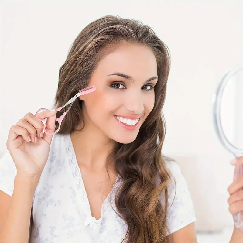Woman with long, wavy hair using a hair straightener in front of a mirror.